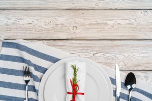 Elegant table setting with festive decor on wooden background