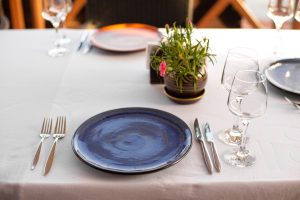 Stylish table setting in an open-air restaurant.
