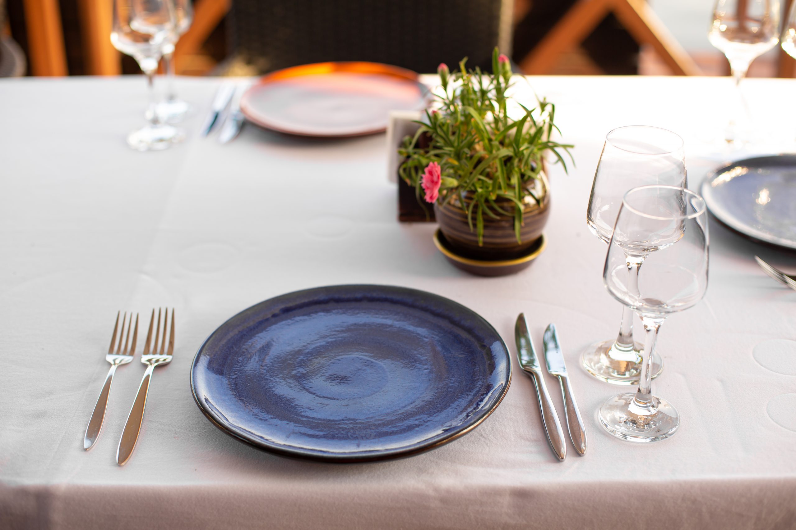 Stylish table setting in an open-air restaurant.