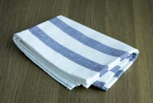 folded napkin on wooden table