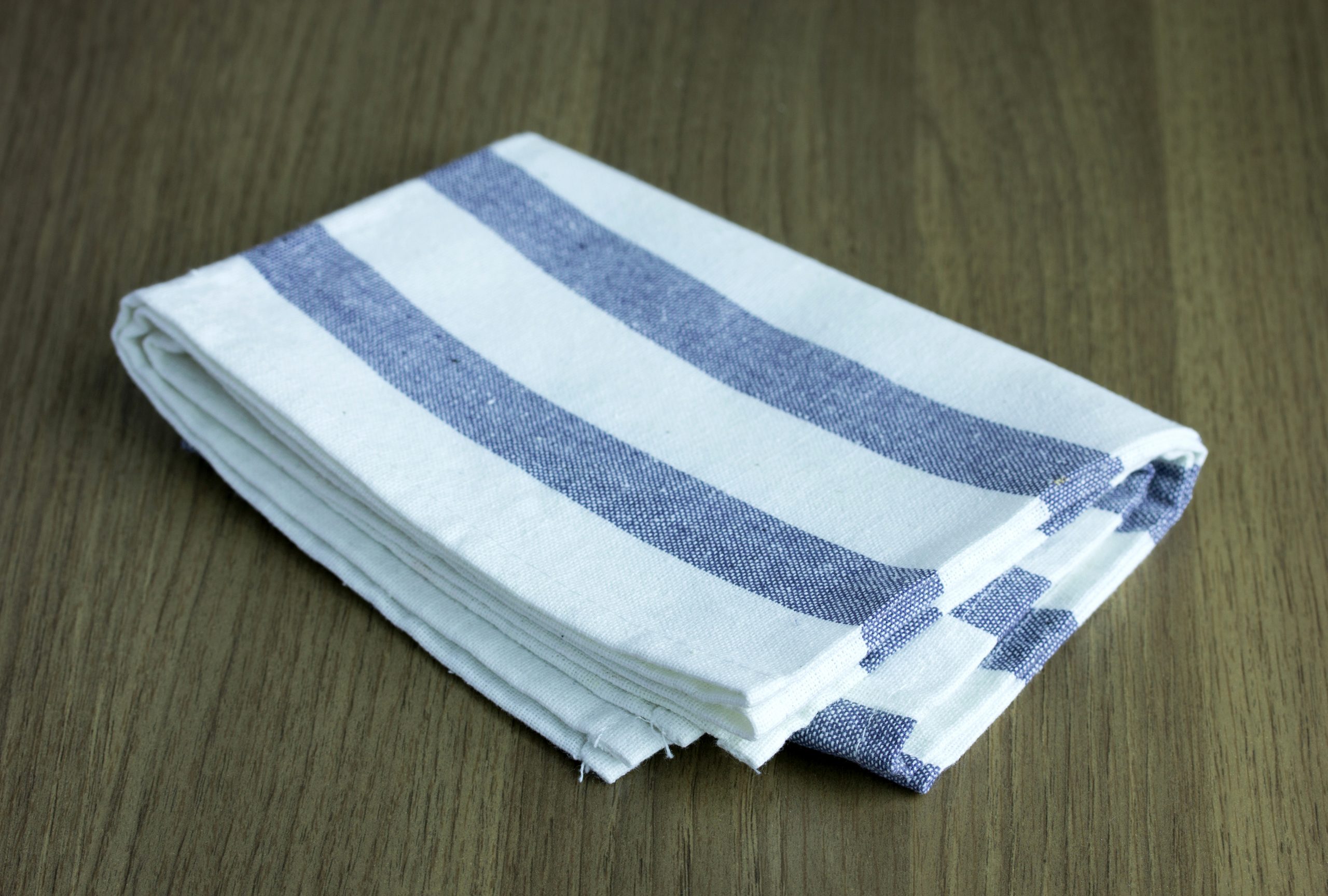 folded napkin on wooden table